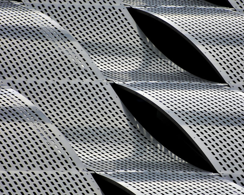 punctured metal sheets waving